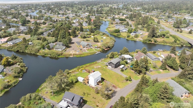 bird's eye view featuring a water view and a residential view