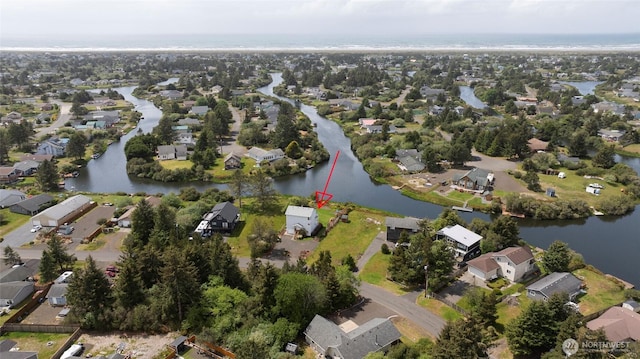 bird's eye view featuring a water view and a residential view