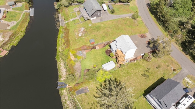 birds eye view of property with a residential view and a water view