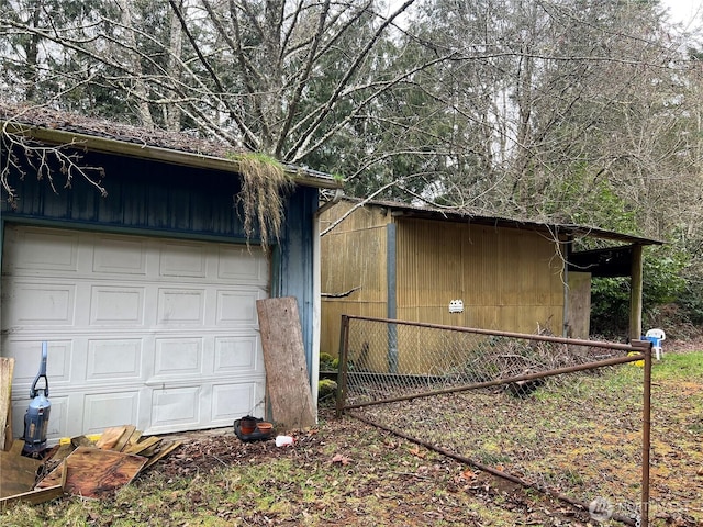 garage with fence