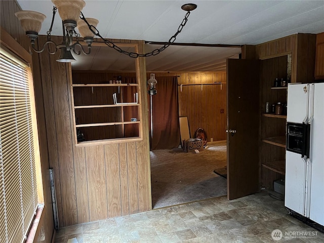 interior space with wood walls and carpet flooring