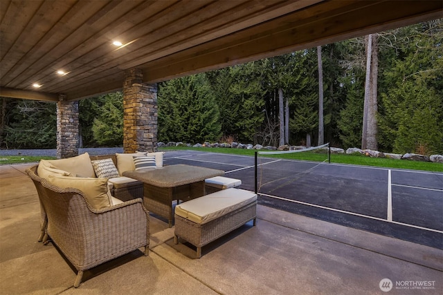 view of patio / terrace with a wooded view