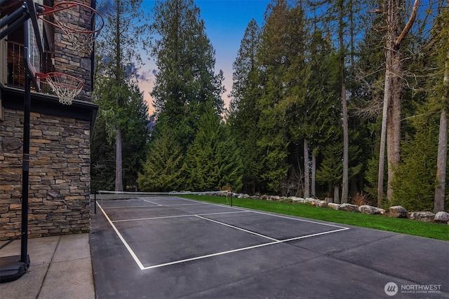 view of basketball court featuring a tennis court