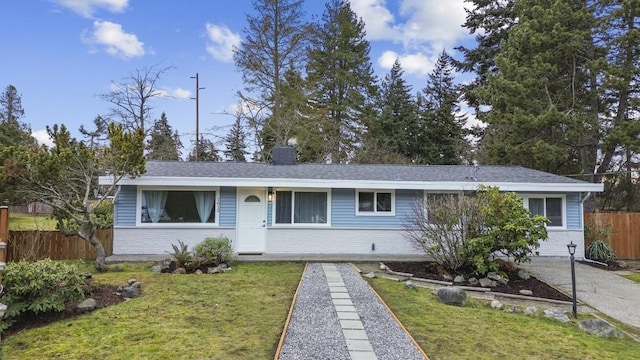 single story home featuring a front lawn, a chimney, and fence