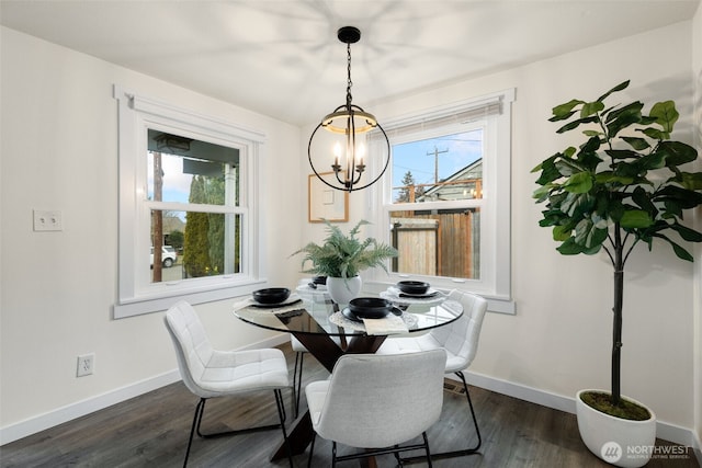 dining space featuring a wealth of natural light, dark wood-style flooring, and baseboards