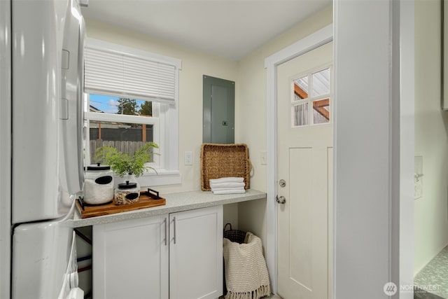 mudroom featuring electric panel