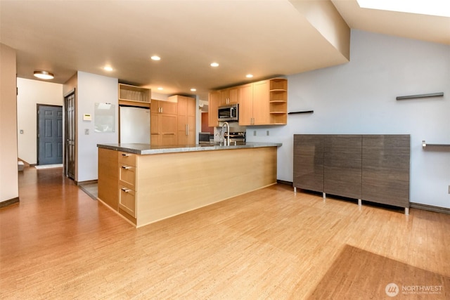 kitchen featuring recessed lighting, a peninsula, light wood-style floors, appliances with stainless steel finishes, and open shelves