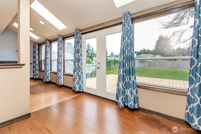 interior space with a skylight and french doors