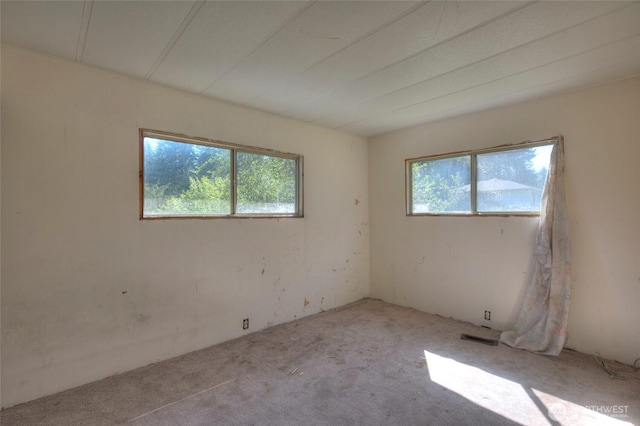 spare room featuring visible vents