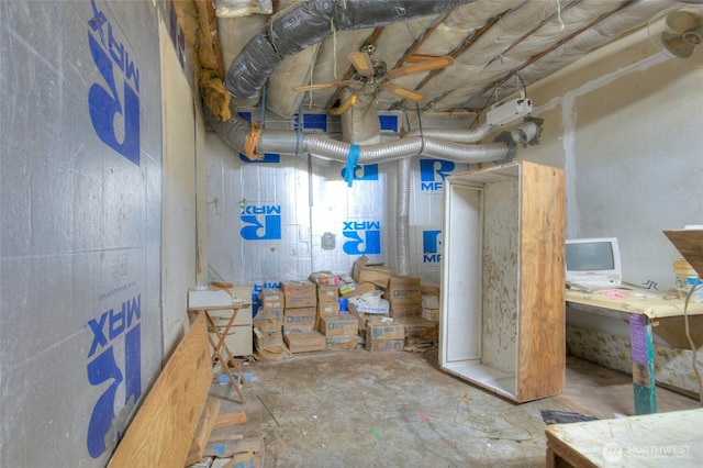 basement with a ceiling fan