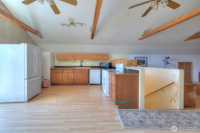 kitchen featuring vaulted ceiling with beams, white appliances, light wood-style floors, and a sink