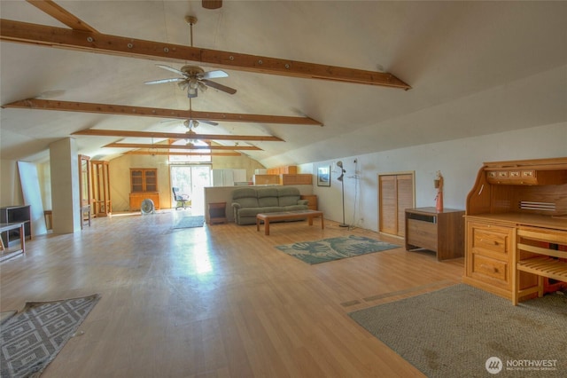 living area featuring ceiling fan, vaulted ceiling with beams, and wood finished floors