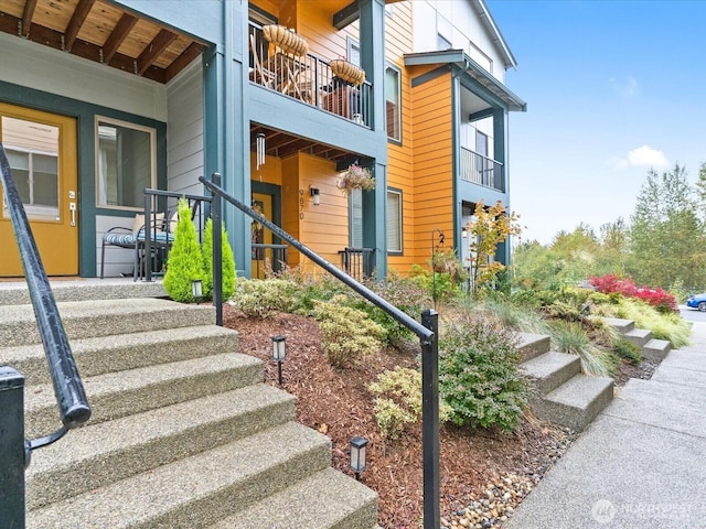 entrance to property featuring a balcony