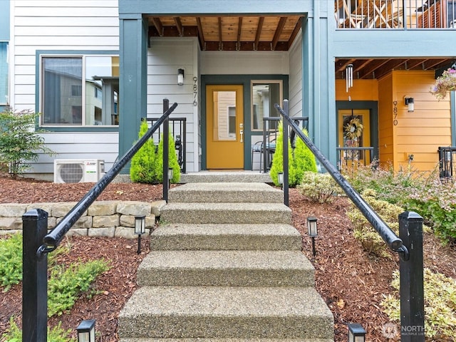 doorway to property featuring ac unit