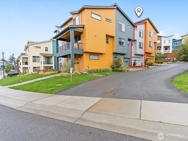 exterior space with a front yard and a residential view