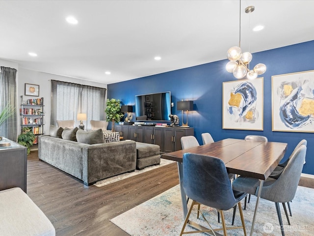 dining space featuring a chandelier, wood finished floors, and recessed lighting