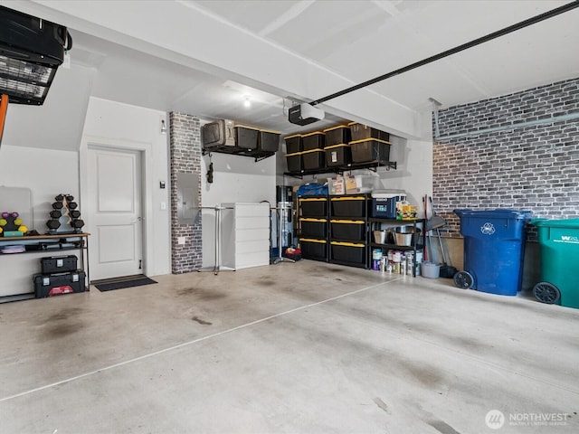 garage with a garage door opener and electric panel