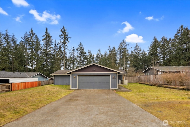 view of front of house with a garage, driveway, a front yard, and fence