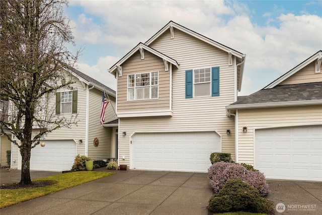 traditional-style home with driveway and an attached garage