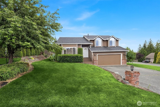 3802 Carpenter St, Mount Vernon, WA 98274 - tri-level home with asphalt driveway, a garage, brick siding, a front yard, and a shingled roof