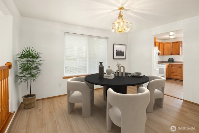 3802 Carpenter St, Mount Vernon, WA 98274 - dining room featuring light wood-type flooring and a chandelier