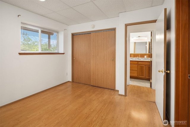 3802 Carpenter St, Mount Vernon, WA 98274 - unfurnished bedroom with a drop ceiling, light wood-style flooring, and a closet