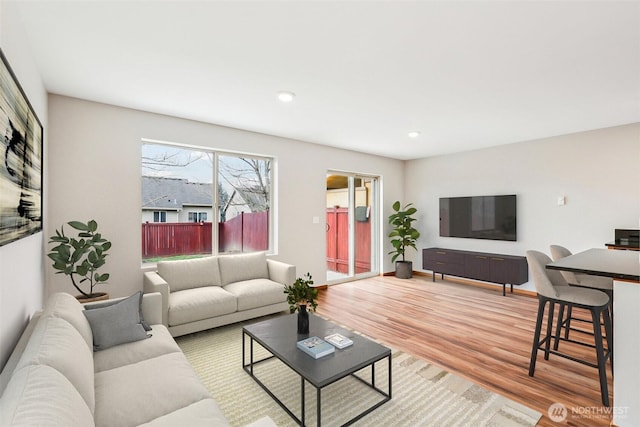 living room featuring recessed lighting and light wood-style floors