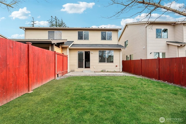 back of property with a patio, a lawn, and a fenced backyard