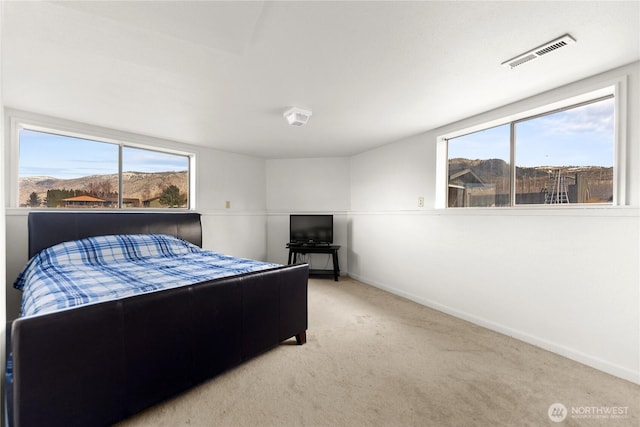 bedroom with baseboards, visible vents, and carpet floors