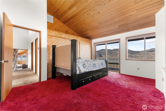 bedroom with a mountain view, carpet, wooden ceiling, access to exterior, and vaulted ceiling