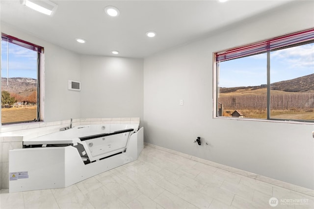 laundry room with visible vents, recessed lighting, and a mountain view