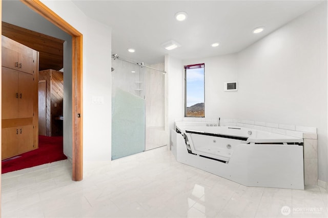 bathroom with recessed lighting, a shower stall, and a whirlpool tub