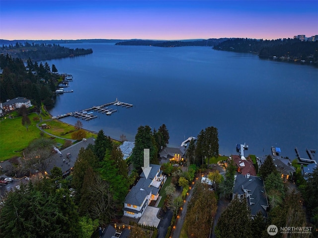 aerial view at dusk with a water view