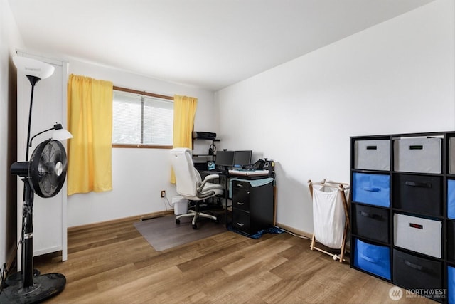 office with baseboards and wood finished floors