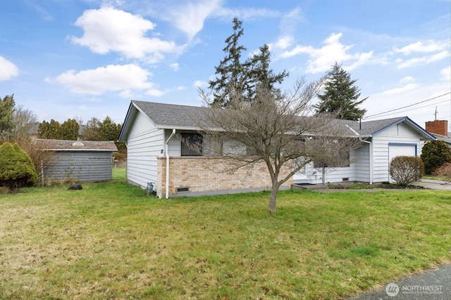 single story home with a garage, a front yard, and brick siding