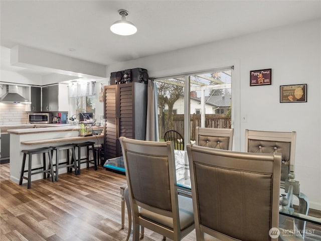 dining area with light wood-style floors