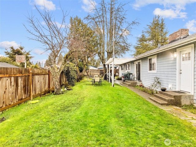 view of yard featuring a fenced backyard