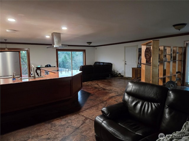 living area featuring recessed lighting and crown molding