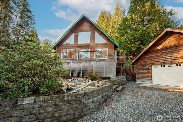 back of house with a wooden deck