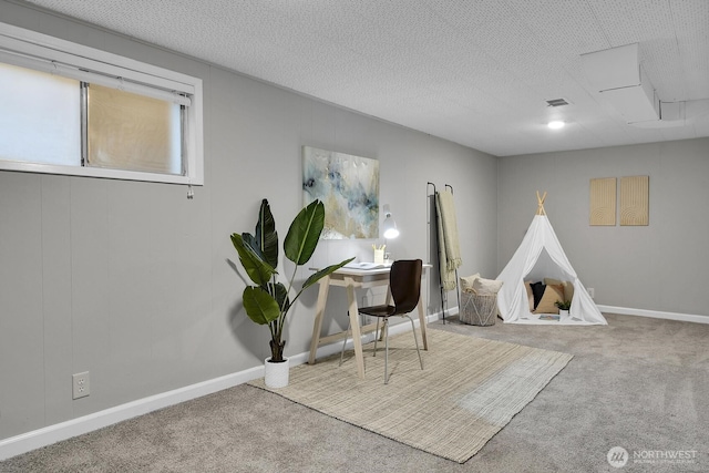 game room featuring a textured ceiling, carpet, visible vents, and baseboards