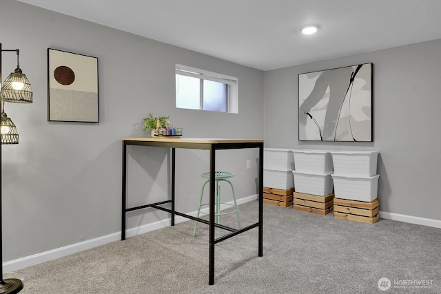 carpeted bedroom featuring baseboards