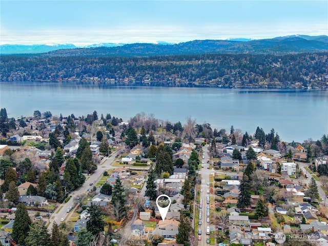 birds eye view of property with a residential view and a water and mountain view