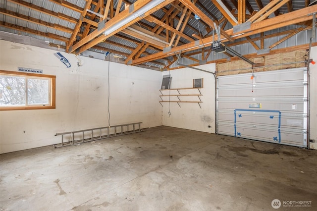 garage with metal wall and a garage door opener