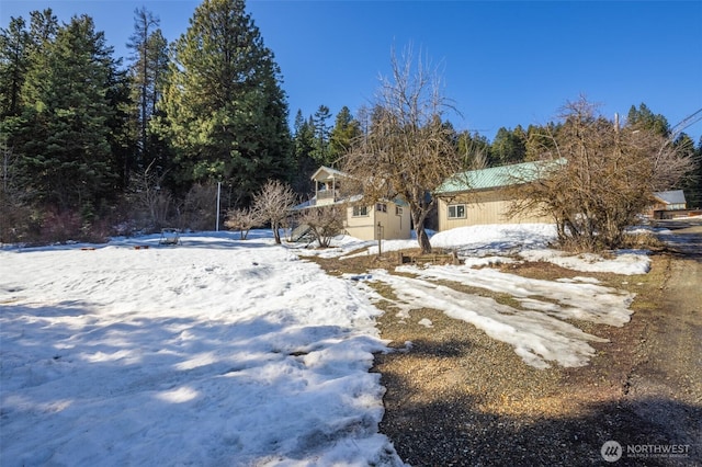 view of yard covered in snow