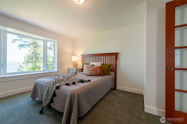 carpeted bedroom with baseboards