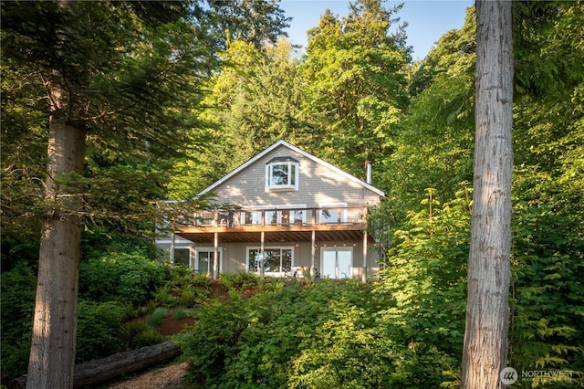 rear view of property with a deck