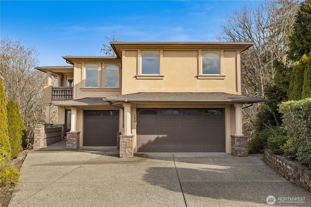 view of front of home featuring stone siding, concrete driveway, an attached garage, and stucco siding