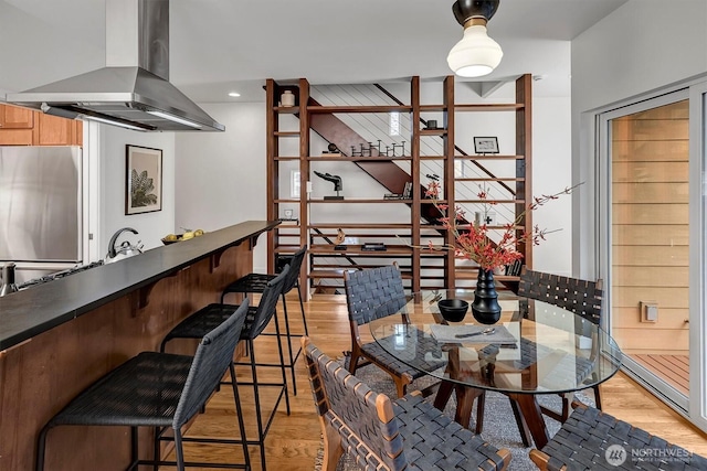 dining area featuring recessed lighting and light wood-style floors