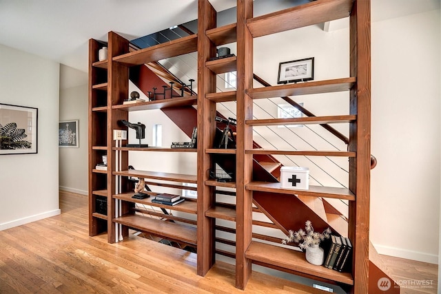 wine area with light wood-style floors and baseboards