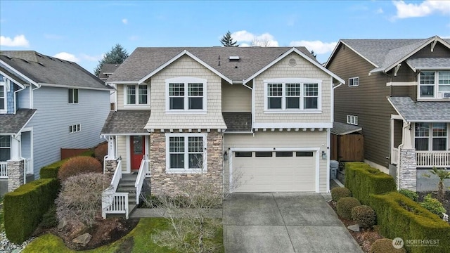 craftsman house featuring stone siding, driveway, a shingled roof, and a garage